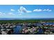 Beautiful aerial view of a waterfront community with homes, canals and a lake in the background at 4804 Longwater Way, Tampa, FL 33615