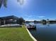 Beautiful backyard with dock, pool, and waterfront views, perfect for relaxation and recreation at 4804 Longwater Way, Tampa, FL 33615