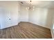 Bright bedroom features tile floors, neutral walls, and modern light fixture at 4804 Longwater Way, Tampa, FL 33615