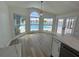 Bright breakfast nook features large windows overlooking the pool and canal at 4804 Longwater Way, Tampa, FL 33615