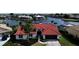 Beautiful single-story home featuring a vibrant red tile roof, well-manicured lawn, and an attached two-car garage at 4804 Longwater Way, Tampa, FL 33615