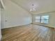 Spacious living room with tile floors, water views, and modern light fixture at 4804 Longwater Way, Tampa, FL 33615