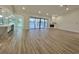 Expansive open-concept layout with an abundance of natural light, views of the lake and pool, and modern finishes at 4804 Longwater Way, Tampa, FL 33615