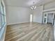 Open living room with tile floors, bright light fixture, and neutral walls at 4804 Longwater Way, Tampa, FL 33615