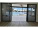 Enjoy outdoor living with a screened-in patio overlooking a pool, spa, and serene lake at 4804 Longwater Way, Tampa, FL 33615