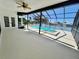 Covered patio featuring pool, hot tub and scenic waterfront views at 4804 Longwater Way, Tampa, FL 33615