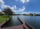 Waterfront view from the backyard featuring a private dock at 4804 Longwater Way, Tampa, FL 33615