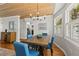 Bright dining room with hardwood floors and stylish chandelier at 522 James St, Dunedin, FL 34698