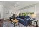 Cozy living room with comfortable seating, ceiling fan, and natural light at 522 James St, Dunedin, FL 34698