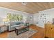 Cozy living room with wood floors, built in shelves, and natural light at 522 James St, Dunedin, FL 34698