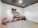 Cozy bedroom with playful star ceiling, dollhouse, and toy car at 5995 59Th N Way, St Petersburg, FL 33709