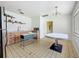 Bright kitchen featuring vintage-style cabinets, shelving, and a table with black base at 5995 59Th N Way, St Petersburg, FL 33709