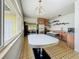 Well-lit kitchen with ample counter space and vintage table and chairs at 5995 59Th N Way, St Petersburg, FL 33709