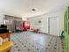 Inviting living room featuring eye-catching tile flooring, colorful decor, and lots of natural light at 5995 59Th N Way, St Petersburg, FL 33709