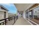 Extended balcony with railing showing view of neighboring buildings and lush landscaping at 600 Garrison Cove Ln # 2B, Tampa, FL 33602