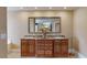Bathroom showcasing a double vanity with granite countertop and a large mirror at 600 Garrison Cove Ln # 2B, Tampa, FL 33602