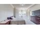 Bright bedroom with natural light, neutral colors, and a large dresser at 600 Garrison Cove Ln # 2B, Tampa, FL 33602