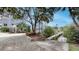 A convenient boat ramp leads to open water access, surrounded by landscaping and paver driveway at 600 Garrison Cove Ln # 2B, Tampa, FL 33602