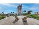 Relax by the resort-style pool with lounge chairs, beautiful landscaping and palm trees on the waterfront at 600 Garrison Cove Ln # 2B, Tampa, FL 33602
