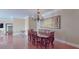 Formal dining room featuring a large painting, decorative chandelier, and seating for eight at 600 Garrison Cove Ln # 2B, Tampa, FL 33602
