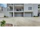 Attached two-car garage provides convenient and secure parking, with neutral paint and modern doors at 600 Garrison Cove Ln # 2B, Tampa, FL 33602