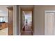Long hallway view featuring hardwood floors, with doors to other rooms on both sides at 600 Garrison Cove Ln # 2B, Tampa, FL 33602
