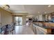 Spacious kitchen with an island, granite countertops, wooden cabinets, and access to the balcony at 600 Garrison Cove Ln # 2B, Tampa, FL 33602