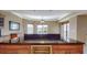 Kitchen island with granite countertops and wine storage with an adjacent dining and living area with large windows at 600 Garrison Cove Ln # 2B, Tampa, FL 33602