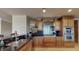 This kitchen boasts stainless steel appliances, custom wood cabinets, and granite countertops at 600 Garrison Cove Ln # 2B, Tampa, FL 33602