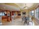 Spacious kitchen with custom cabinets, stainless appliances, island, and dining area at 600 Garrison Cove Ln # 2B, Tampa, FL 33602