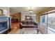 Open-concept living room with hardwood floors, balcony, and plenty of seating at 600 Garrison Cove Ln # 2B, Tampa, FL 33602