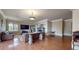 Comfortable living room with hardwood floors, a fireplace, and lots of natural light at 600 Garrison Cove Ln # 2B, Tampa, FL 33602