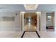 Entrance featuring tiled flooring, pillars, and contemporary artwork at 600 Garrison Cove Ln # 2B, Tampa, FL 33602