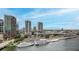 Waterfront view featuring skyscrapers, luxury yachts, and ample parking near retail spaces at 600 Garrison Cove Ln # 2B, Tampa, FL 33602