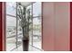 Window view featuring a tall potted plant in front of corner windows overlooking the waterway at 600 Garrison Cove Ln # 2B, Tampa, FL 33602