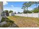 Expansive backyard showcasing a shed, partial fence, and lawn at 7313 8Th N Ave, St Petersburg, FL 33710