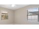 Cozy bedroom featuring neutral walls, two windows, and a ceiling fan for added comfort at 7313 8Th N Ave, St Petersburg, FL 33710