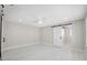 Large main bedroom with white floors and sliding barn doors at 7313 8Th N Ave, St Petersburg, FL 33710