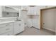 Modern kitchen featuring white cabinets, a stainless steel sink, and elegant quartz countertops at 7313 8Th N Ave, St Petersburg, FL 33710