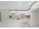 Renovated kitchen with a peninsula, white cabinets, and stainless steel appliances at 7313 8Th N Ave, St Petersburg, FL 33710