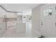Bright, open kitchen featuring white cabinetry, quartz countertops, and modern fixtures at 7313 8Th N Ave, St Petersburg, FL 33710