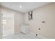 Functional laundry room with utility sink, modern water heater, and bright natural light at 7313 8Th N Ave, St Petersburg, FL 33710