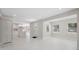 Open-concept living space with neutral walls, recessed lighting, and a view of the kitchen at 7313 8Th N Ave, St Petersburg, FL 33710