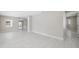 Open living area featuring neutral walls, recessed lighting, light flooring, and a modern aesthetic at 7313 8Th N Ave, St Petersburg, FL 33710