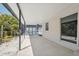 Covered back patio provides transition to a caged pool, perfect for relaxation and entertaining outdoors at 7313 8Th N Ave, St Petersburg, FL 33710