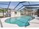 Screened in pool with a view of the exterior of the house and blue skies above at 7313 8Th N Ave, St Petersburg, FL 33710