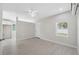 Bright room with a ceiling fan, featuring neutral walls, light hardwood flooring, and recessed lighting at 7313 8Th N Ave, St Petersburg, FL 33710