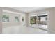 Bright room featuring recessed lighting, neutral walls, light flooring, and a large sliding glass door at 7313 8Th N Ave, St Petersburg, FL 33710