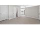 Spacious room featuring neutral walls and light hardwood flooring, with doors to other rooms at 7313 8Th N Ave, St Petersburg, FL 33710