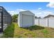 A white shed adds functional storage space in the backyard for outdoor equipment and tools at 7313 8Th N Ave, St Petersburg, FL 33710